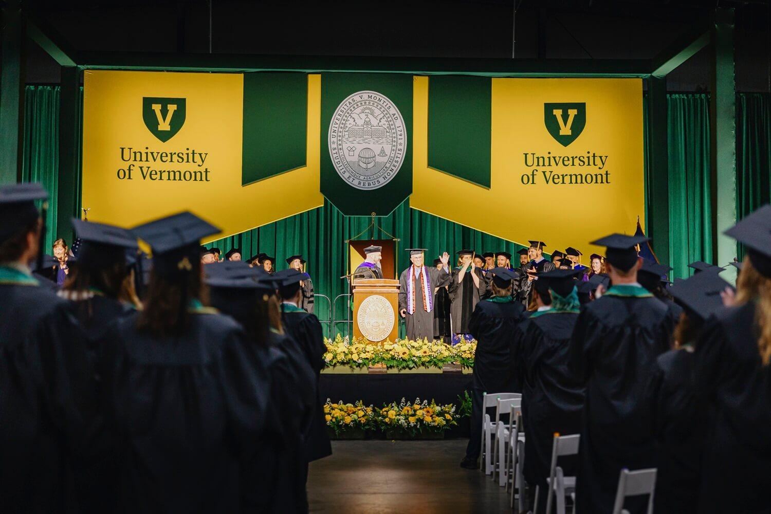 Dave Kaufman standing on the stage at the RSENR Commencement ceremony in May 2025 waving to a cheering crowd