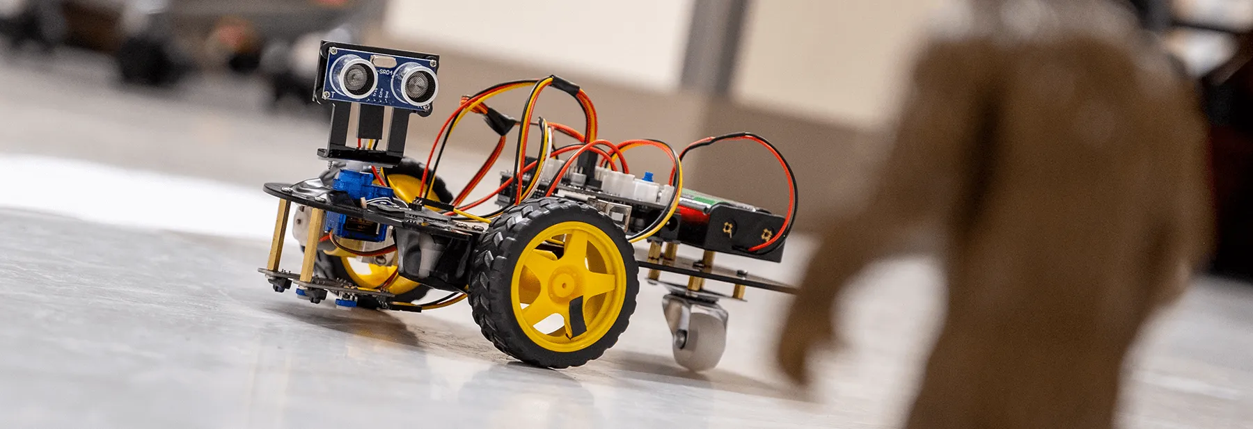 An autonomous robotics device spots its prey during a competition in an electronics engineering class
