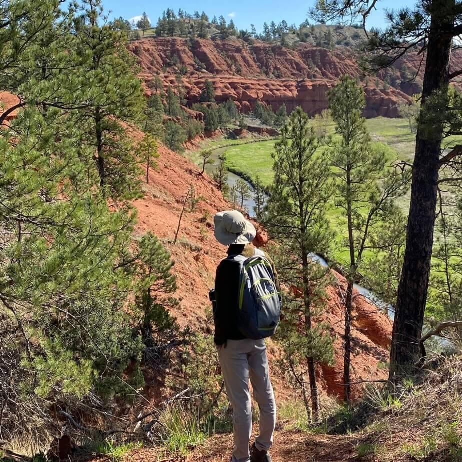 Spencer facing a canyon in Wyoming.