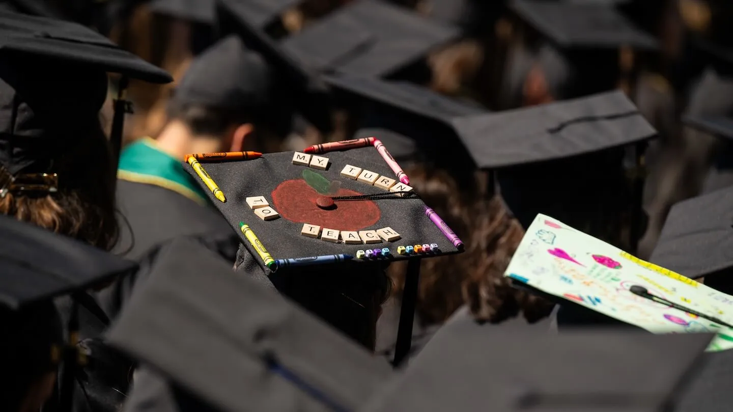 A group of mortarboard hats from behind
