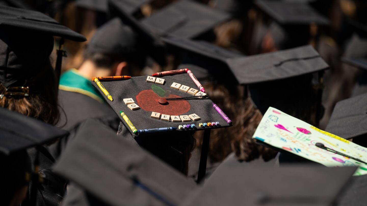 A group of mortarboard hats from behind