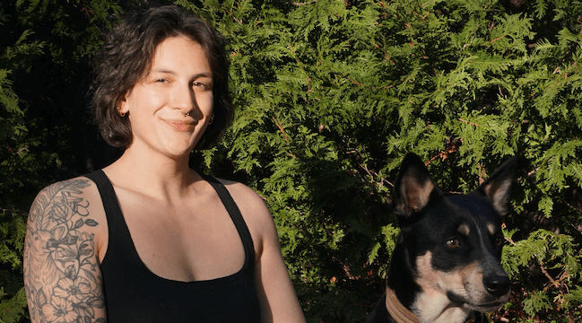 young person sitting with dog