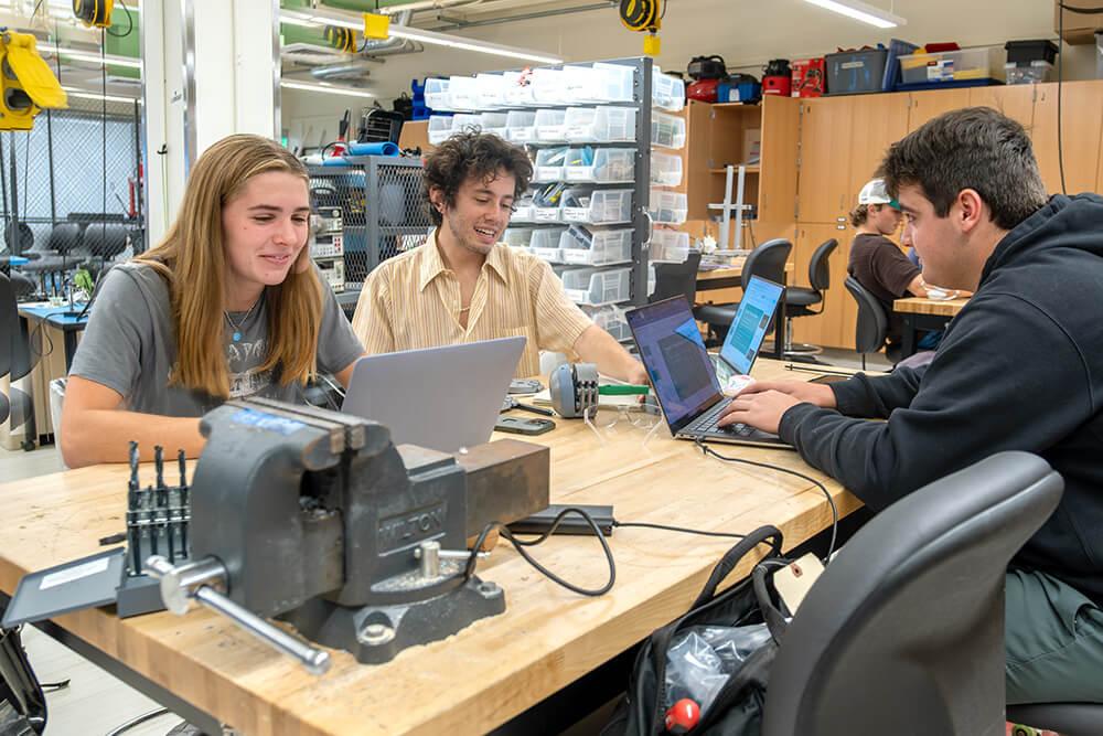 Paige Koterba works alongside her teammates Colin Rudy and Michael Rizzo on their senior capstone project, a quick-connect head attachment system for professional grade outdoor power equipment.