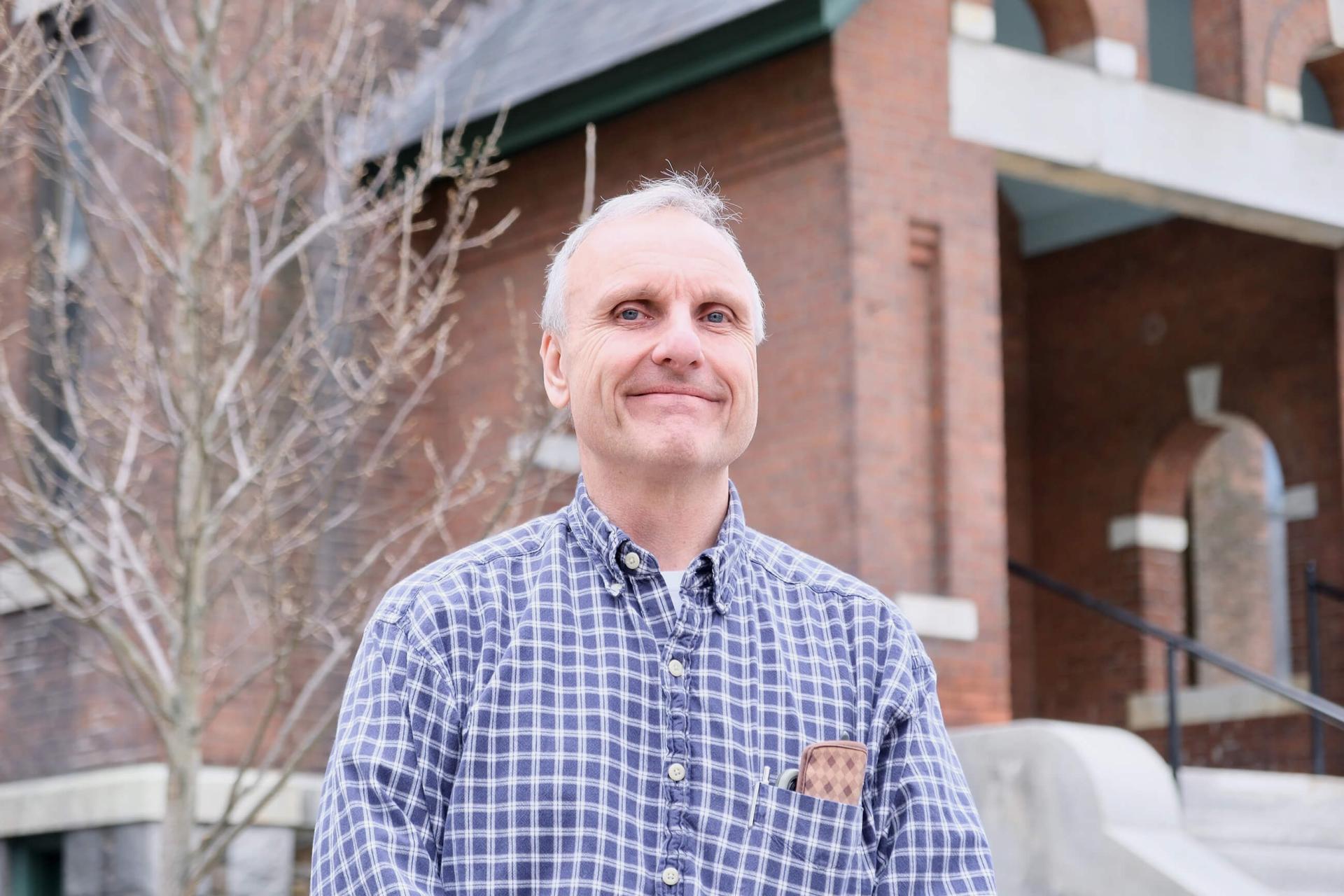 a man standing in front of a building