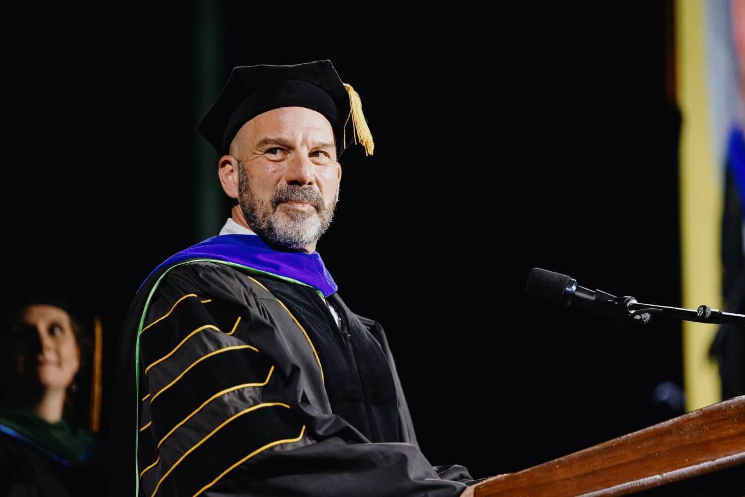Peter Newman speaking during commencement