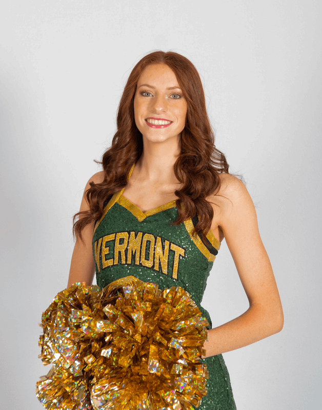 Girl in a UVM Dance club outfit