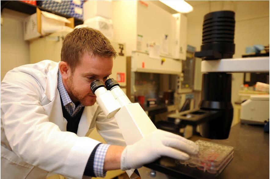Sean Diehl at microscope