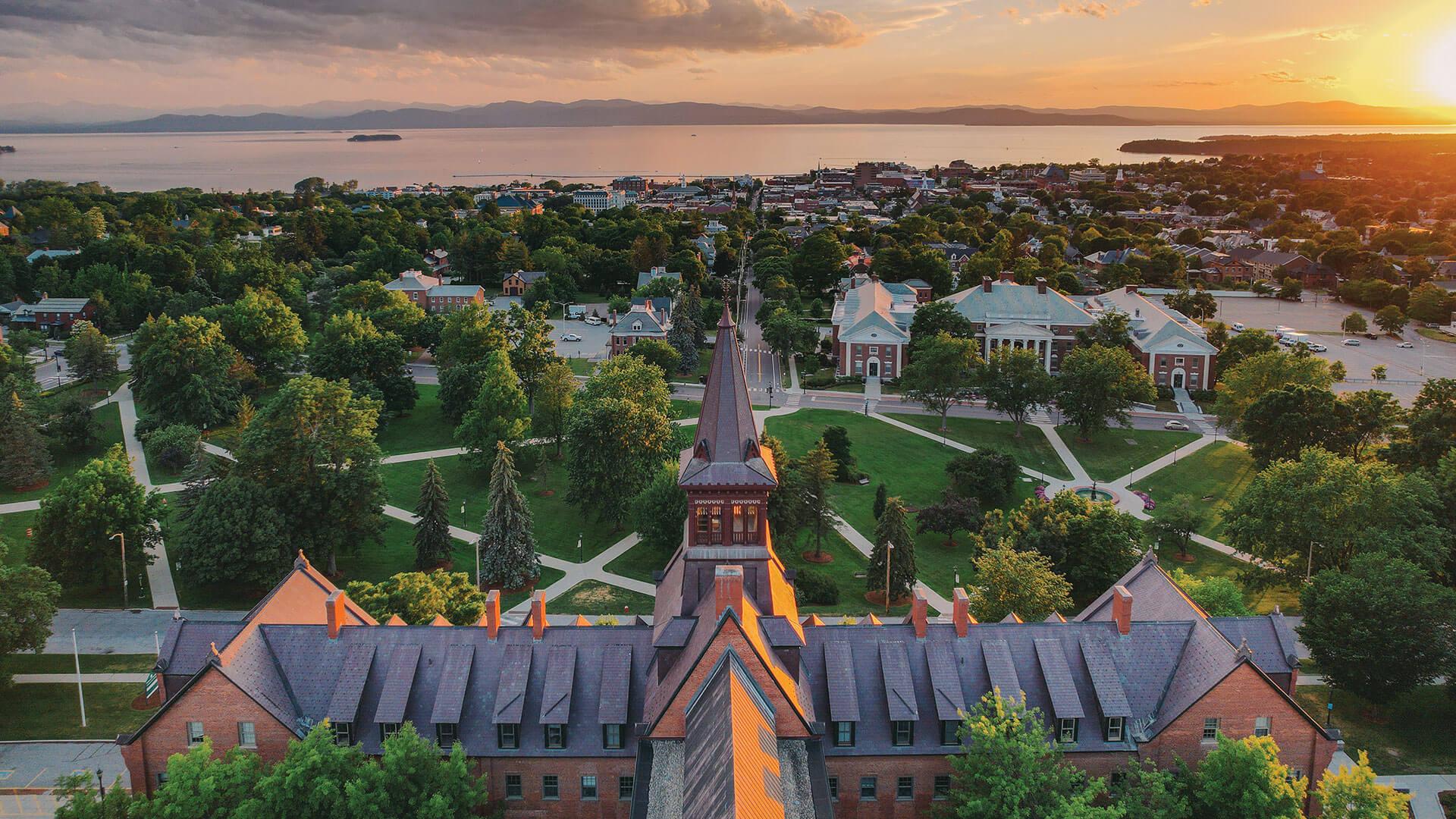 drone shot of old mill with burlington and lake champlain in the background
