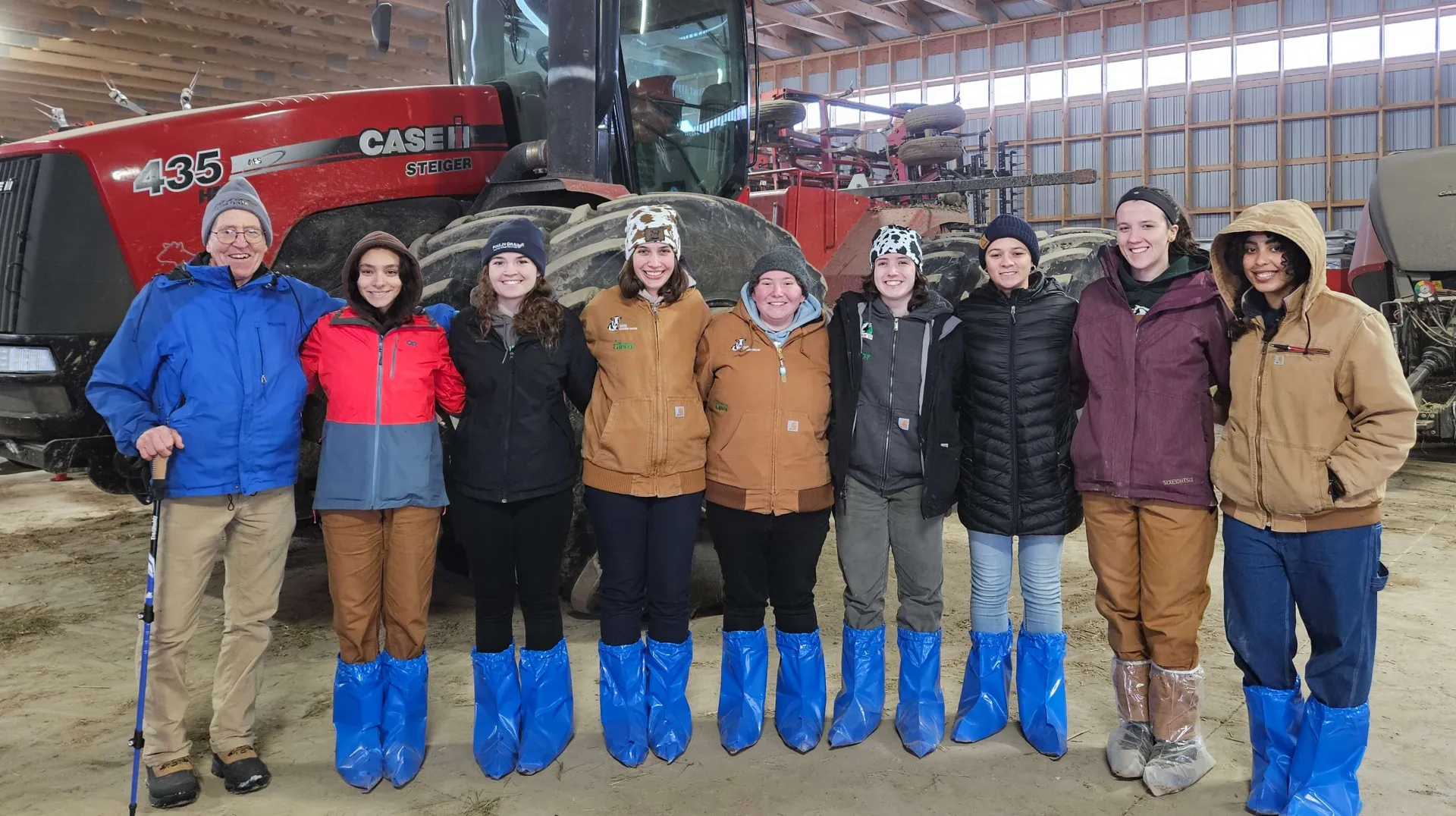 Students in a dairy barn on tour