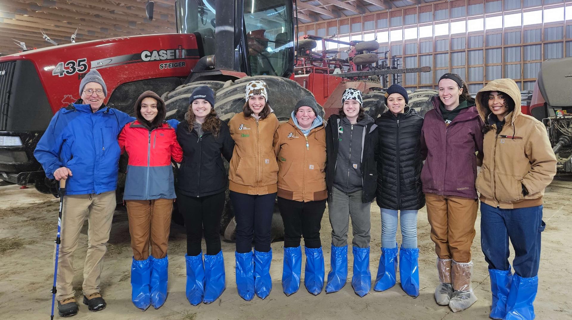 Students in a dairy barn on tour