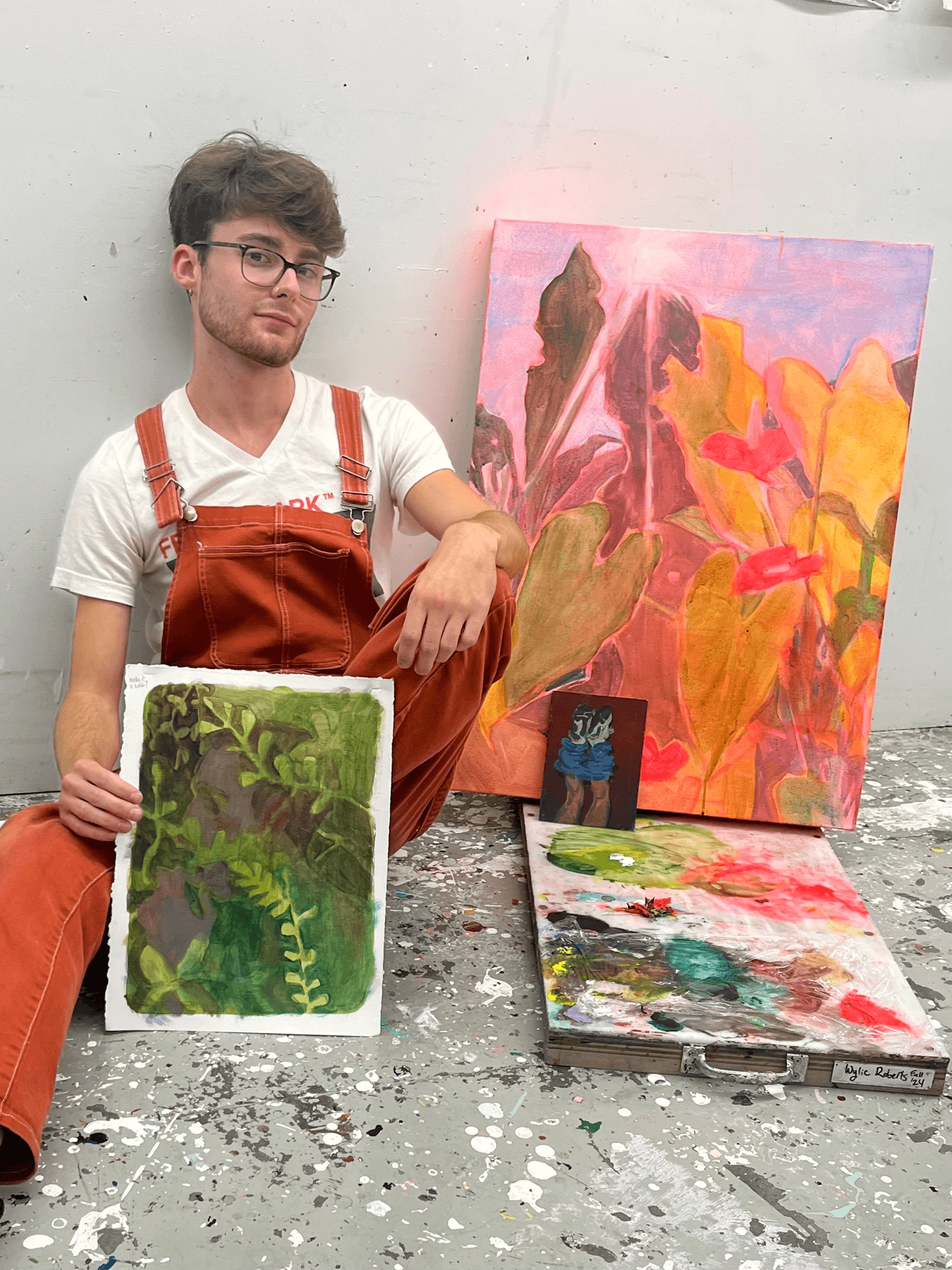 Student with his paintings