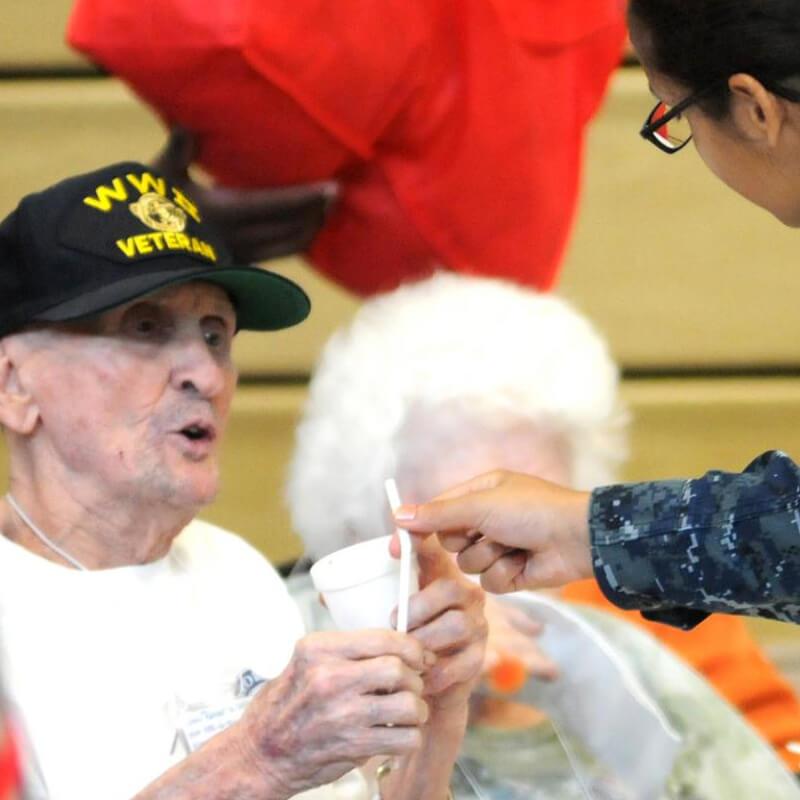man receiving a drink