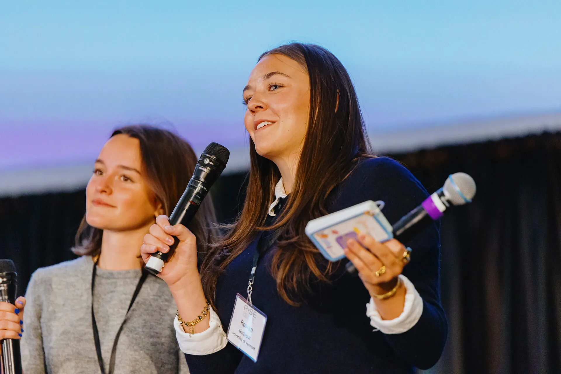 Two students present on stage