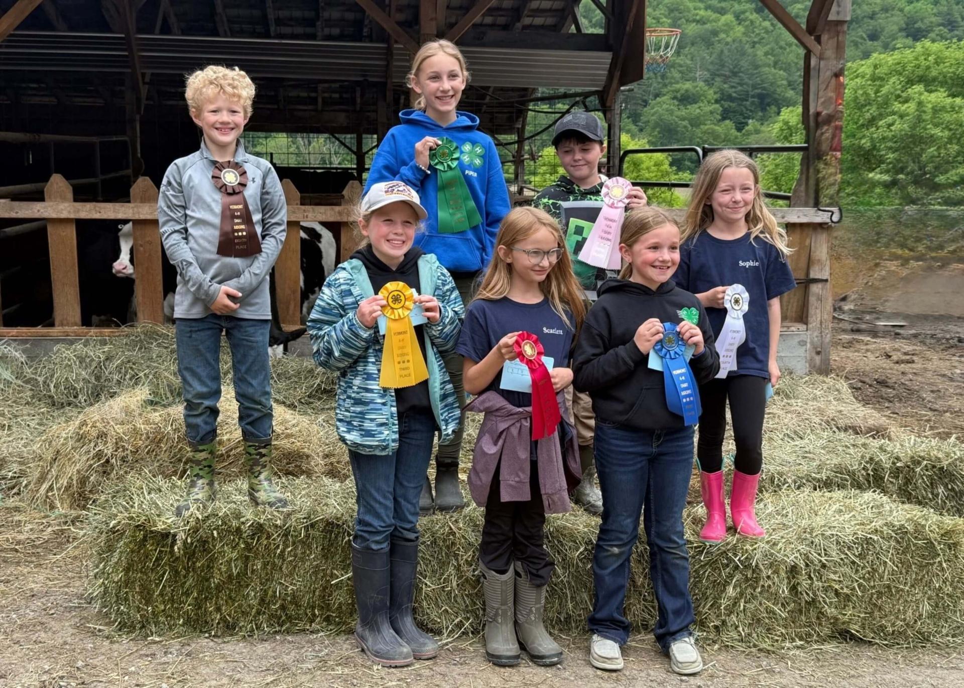 group of 4-h'ers holding ribbons