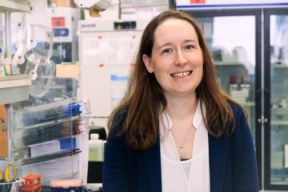 Emily Bruce smiling in her lab