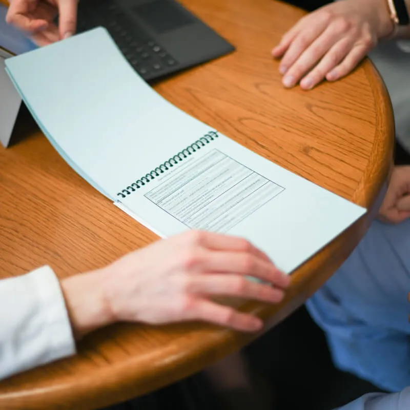 Closeup of people reviewing paperwork