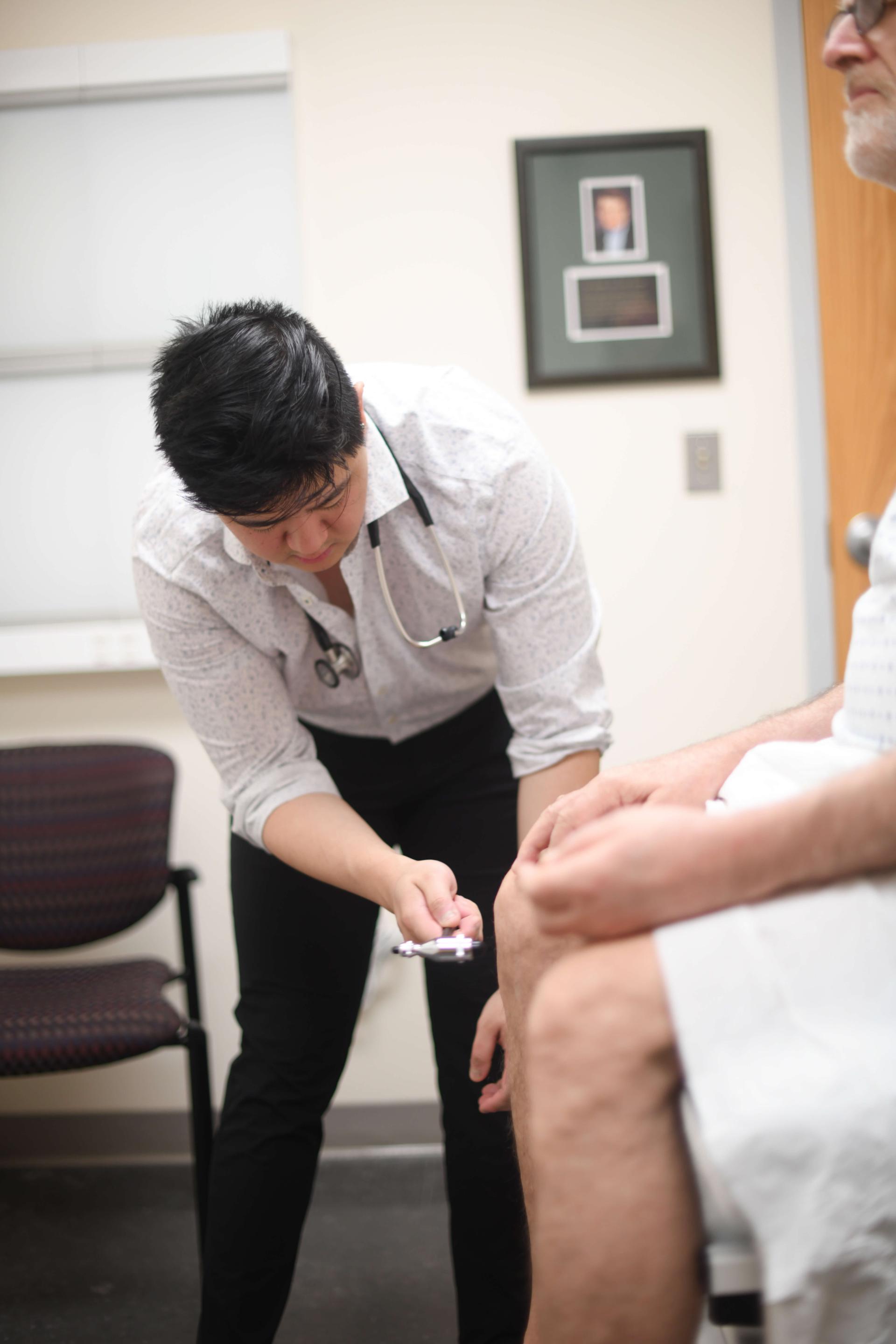 Resident completing a screening with a patient
