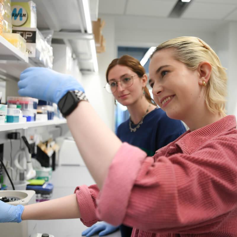 two graduate students having fun in the lab