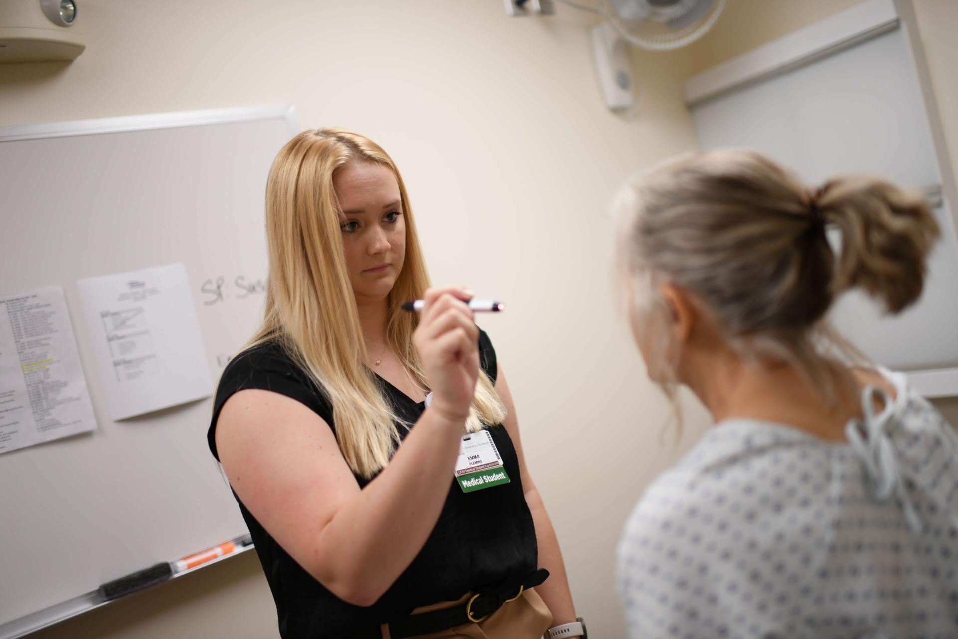 Resident running patient thru screening