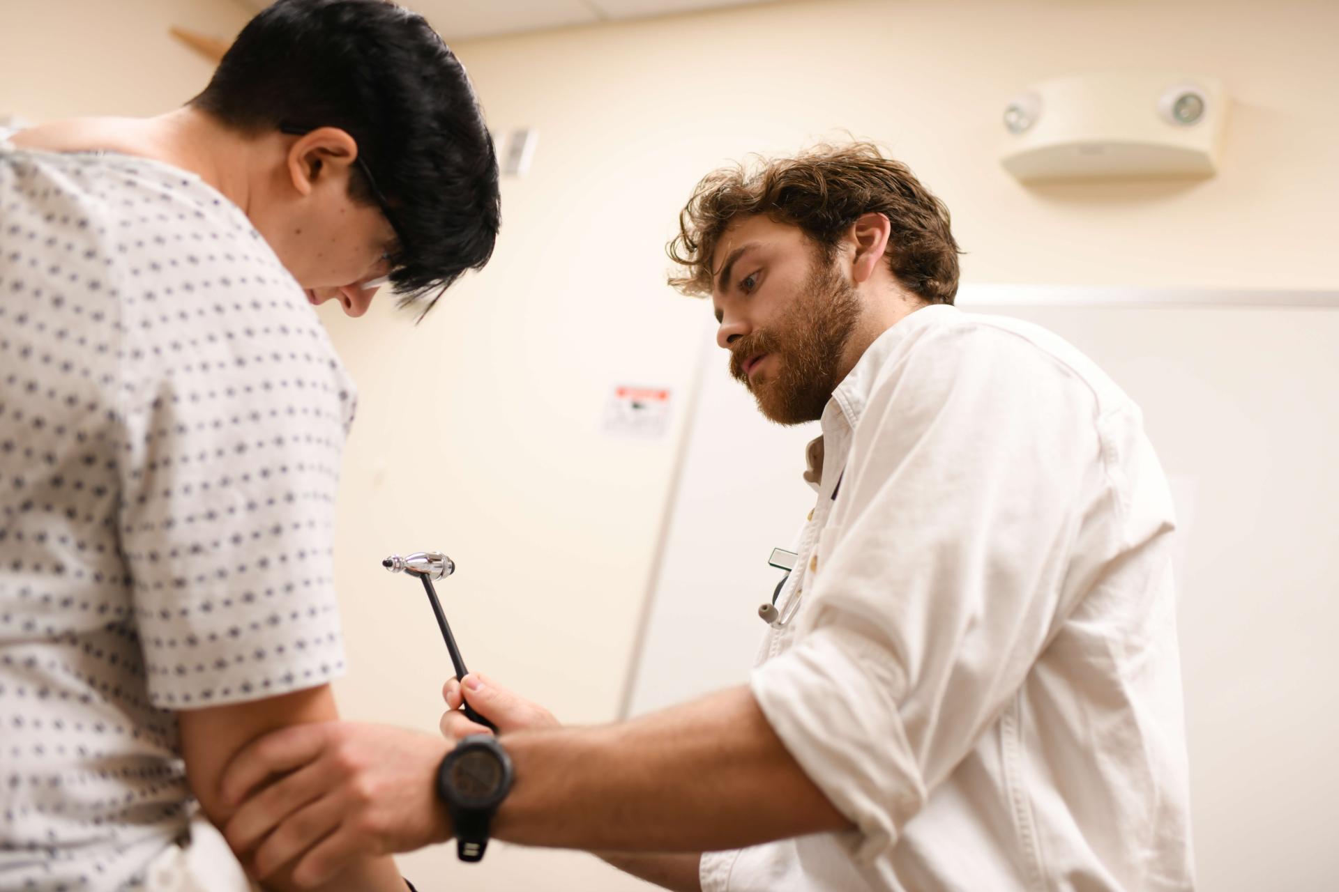 Resident working with patient