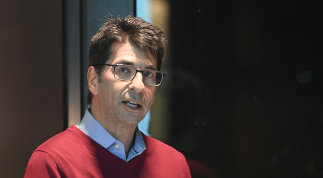 a person in a red sweater and glasses