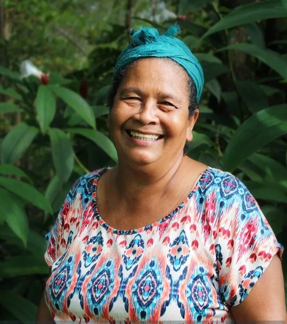 A picture of Eida, she is smiling and wearing a colorful shirt