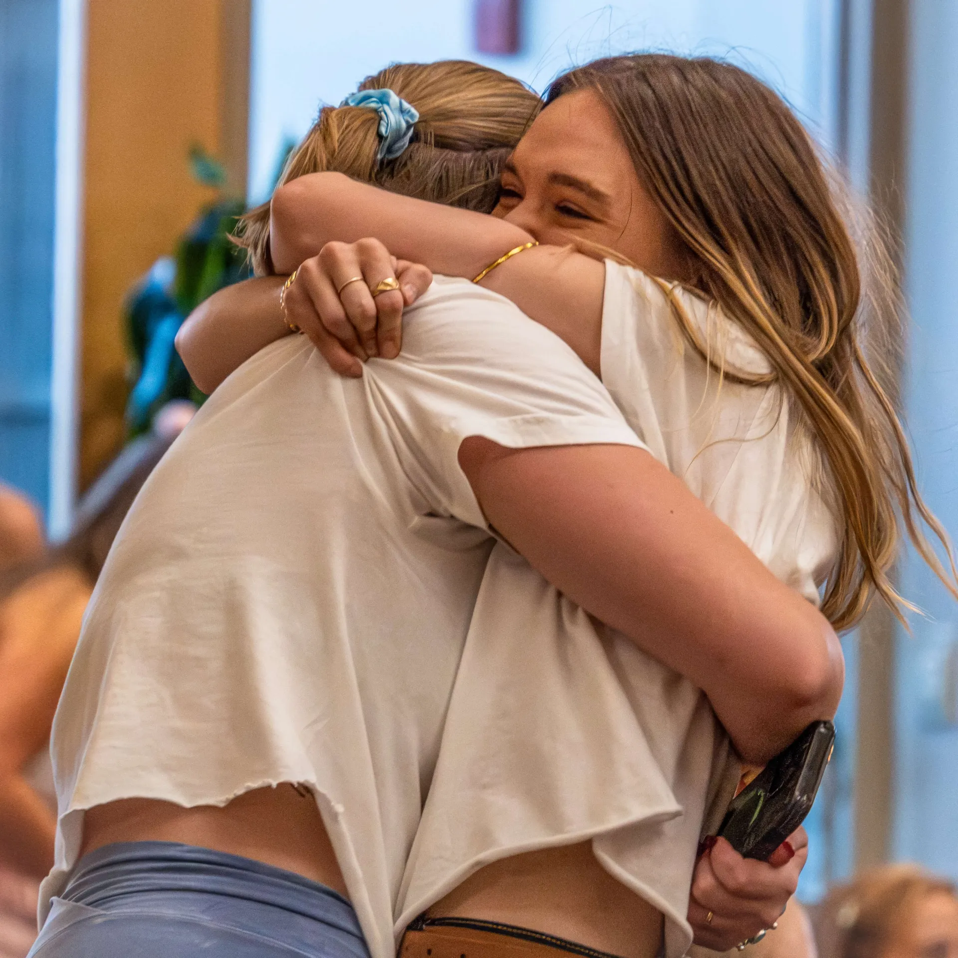 Two sorority member embrace at formal recruitment