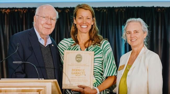 three people are part of an award