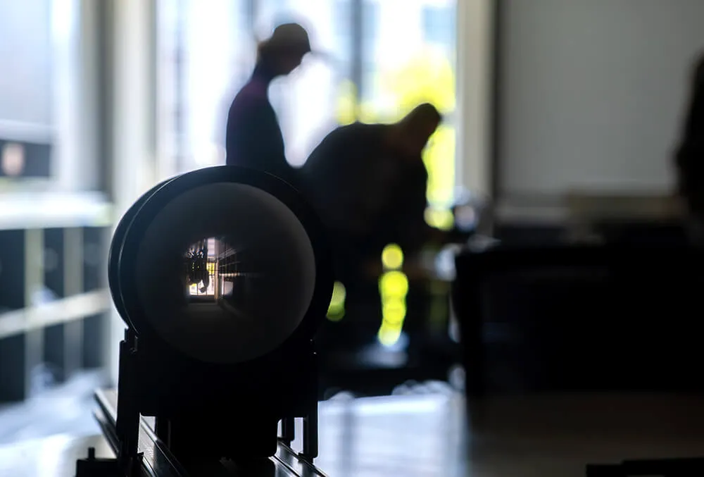 Agroecology fellowship students take part in a Physics light and lens demonstration.