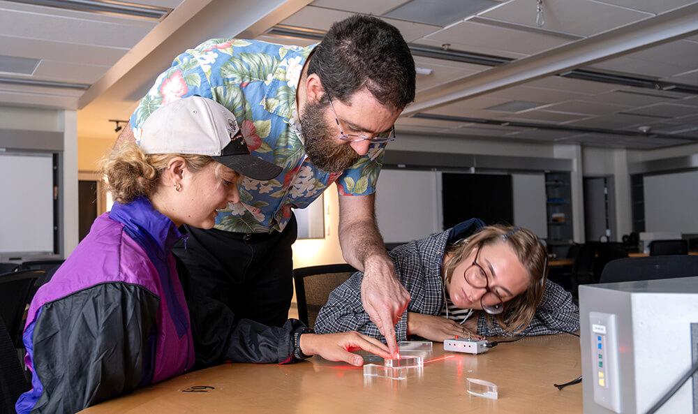 Agroecology fellowship students take part in a Physics light and lens demonstration.