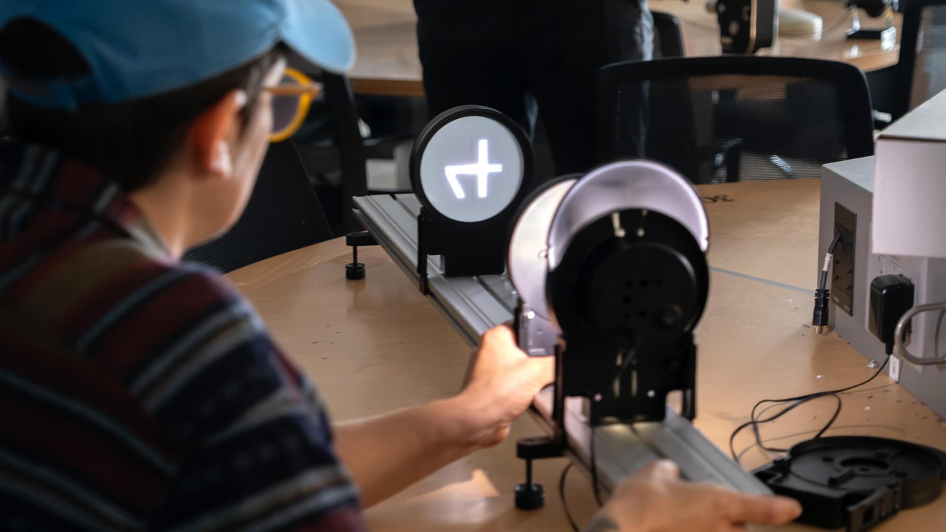 Agroecology fellowship students take part in a Physics light and lens demonstration.