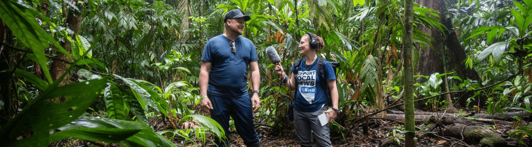 University of Nevada, Reno student Kat Fulwider, reporting from Costa Rica for KUNR. They are standing in a lush jungle.