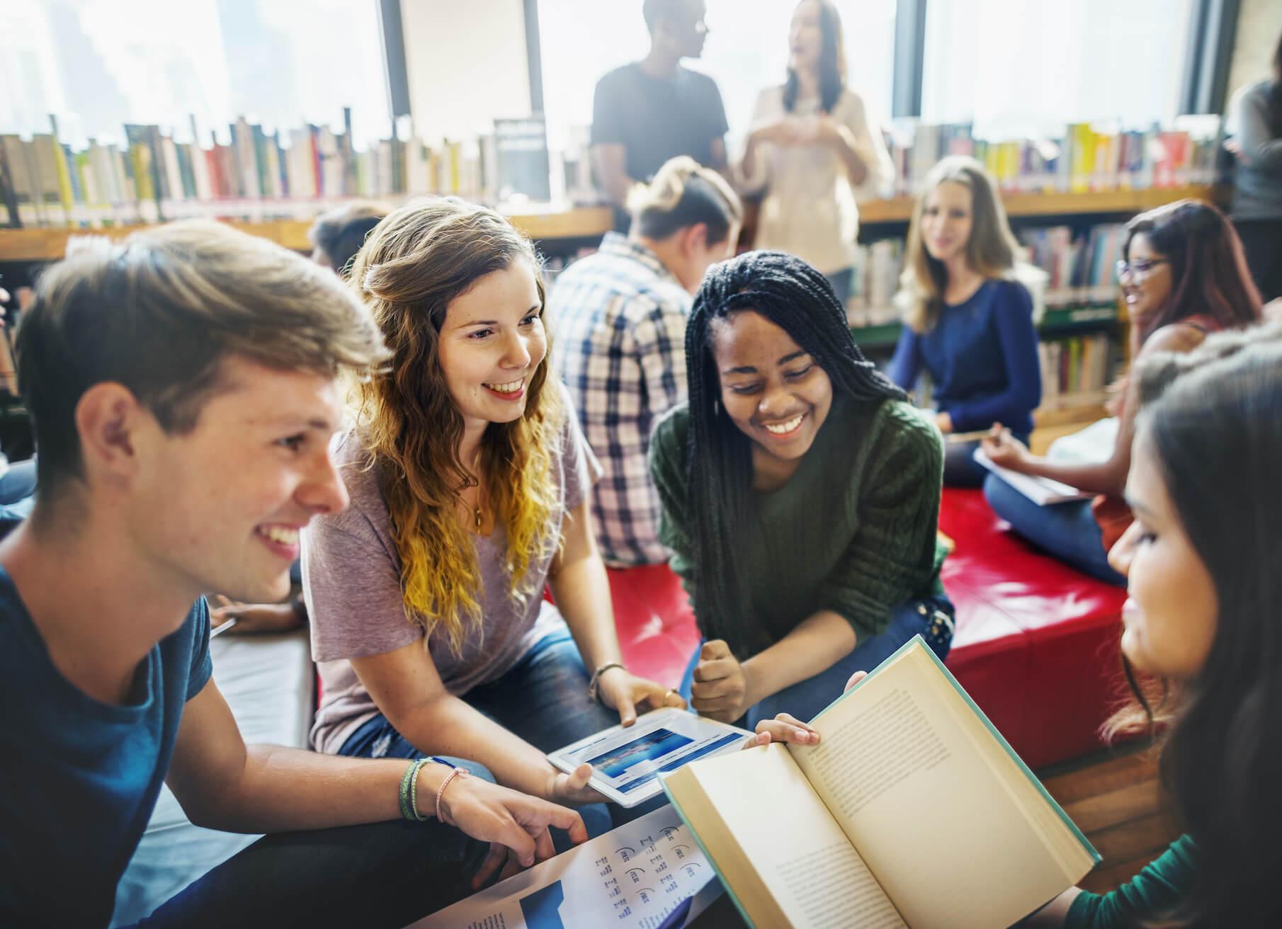Students working on a group project in a school library.