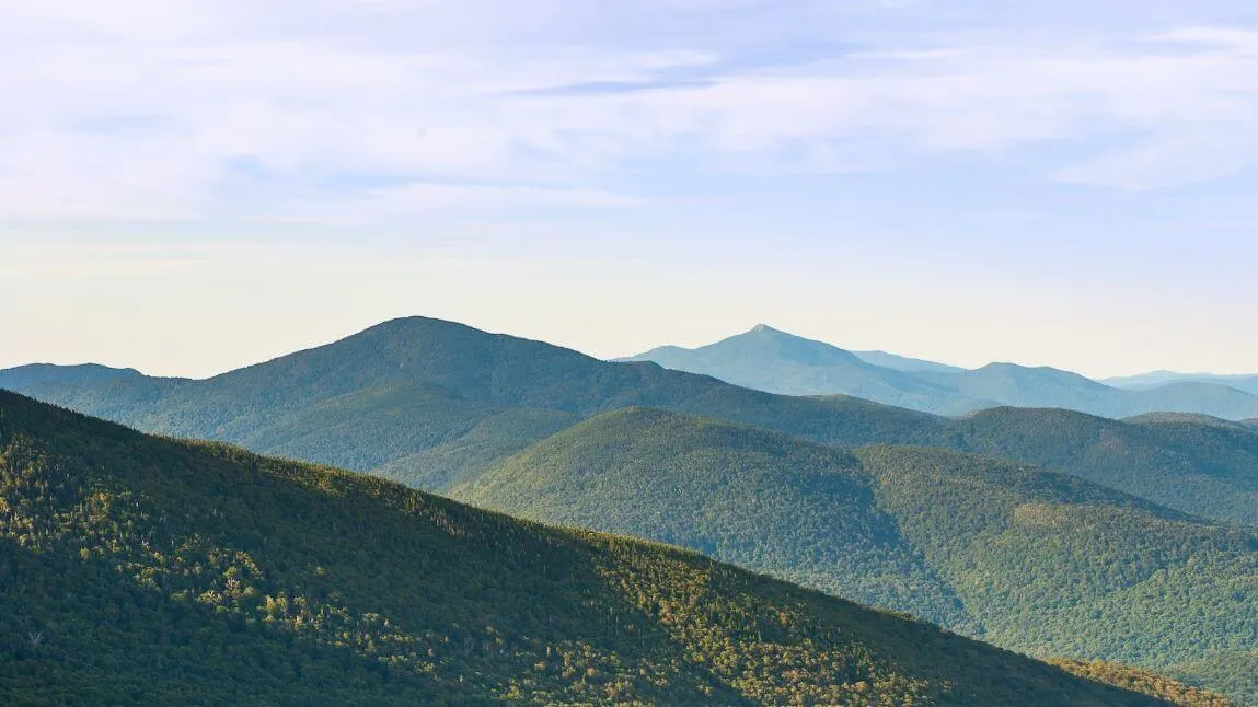 Green mountains against a summer sky