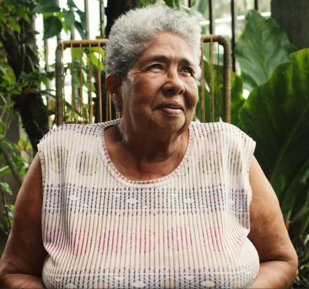 A picture of Tinita she is smiling and looking off to the right
