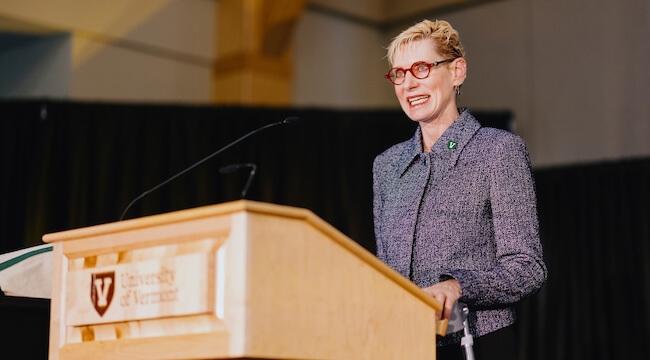 a woman speaking at a podium