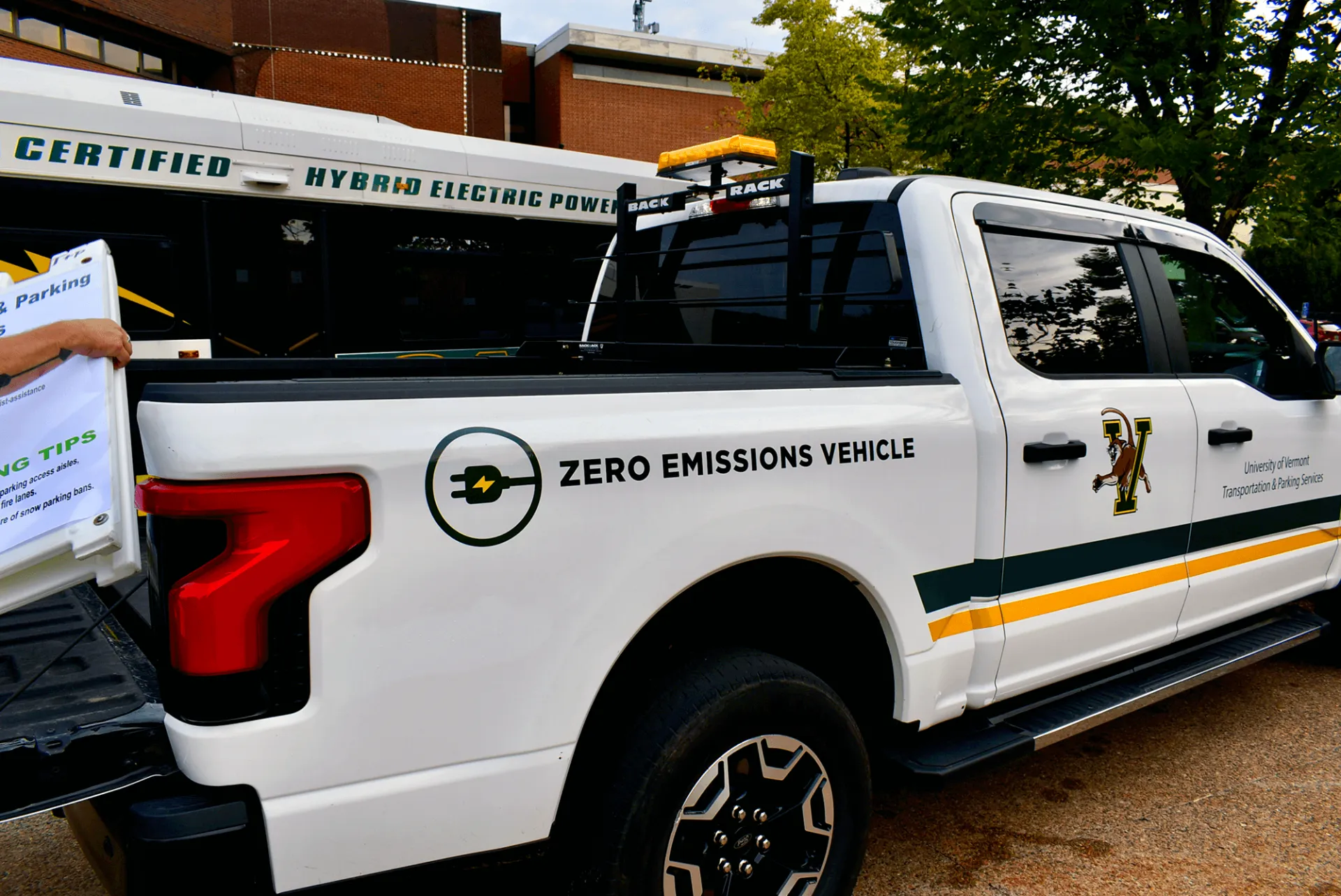 A hybrid bus and EV truck are part of the TPS fleet