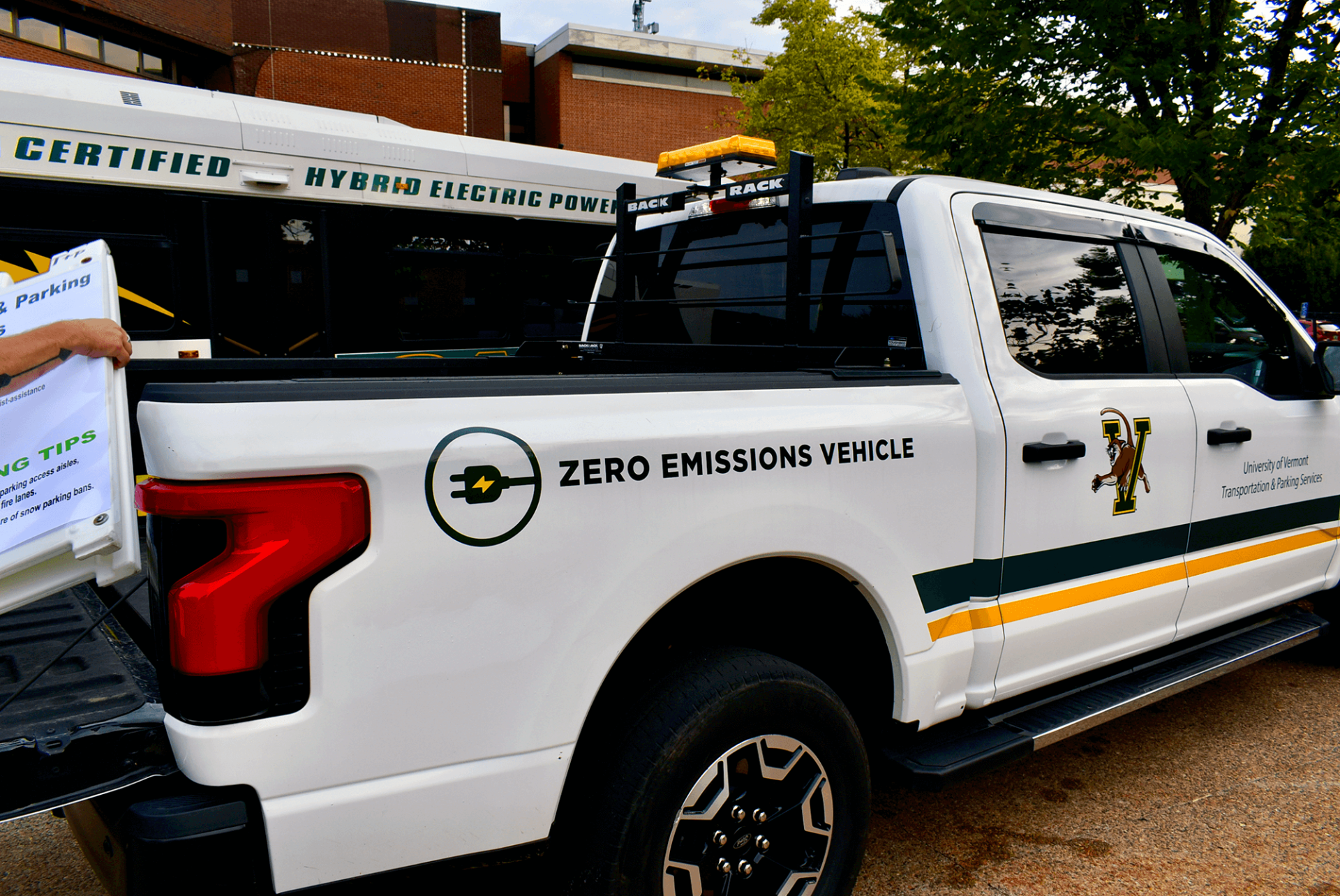A hybrid bus and EV truck are part of the TPS fleet