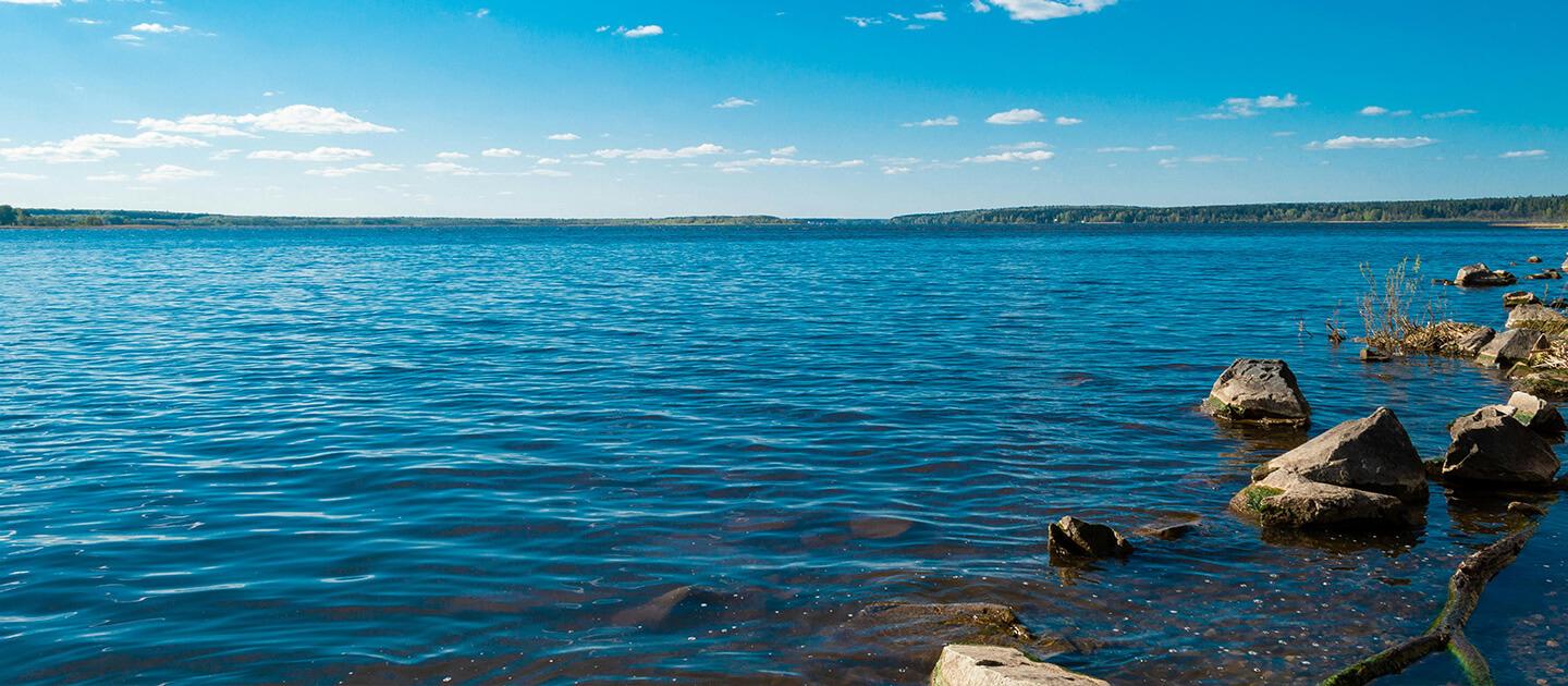 a lake under blue skies