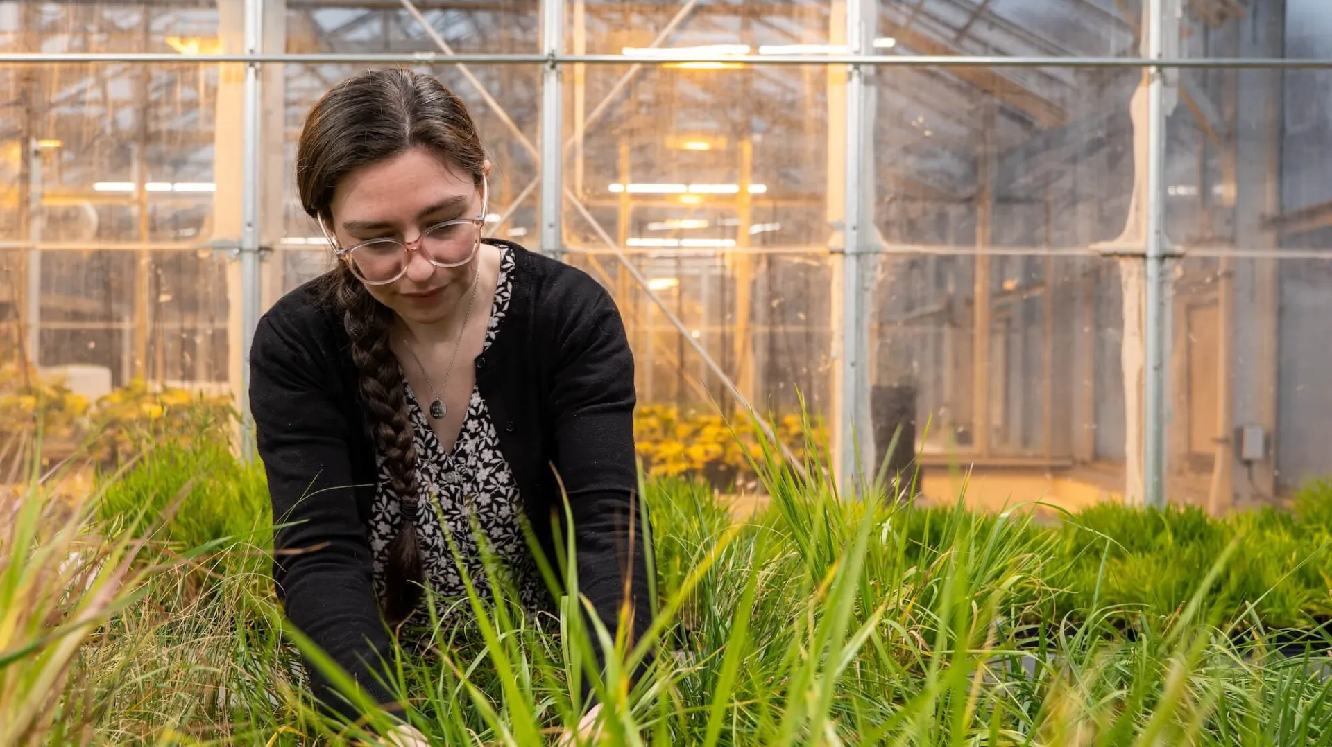 Hannah Shafer in the greenhouse