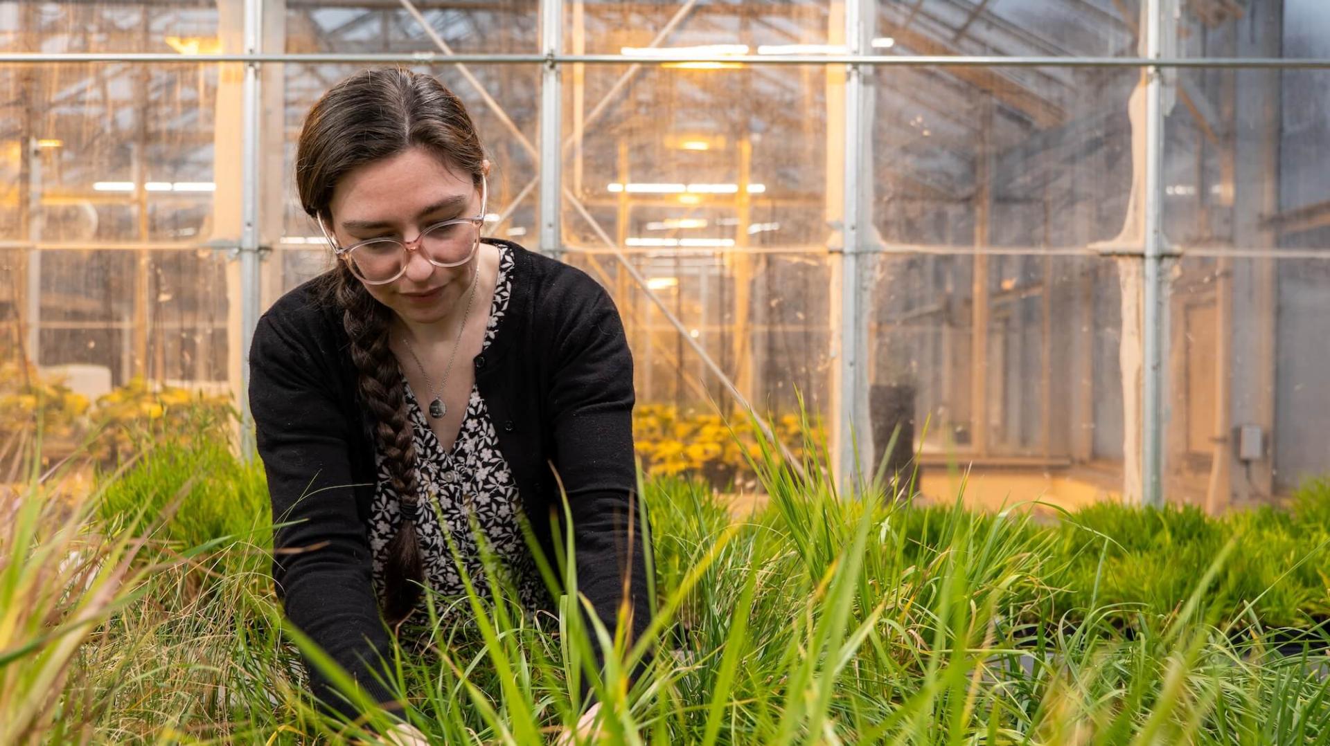 Hannah Shafer in the greenhouse
