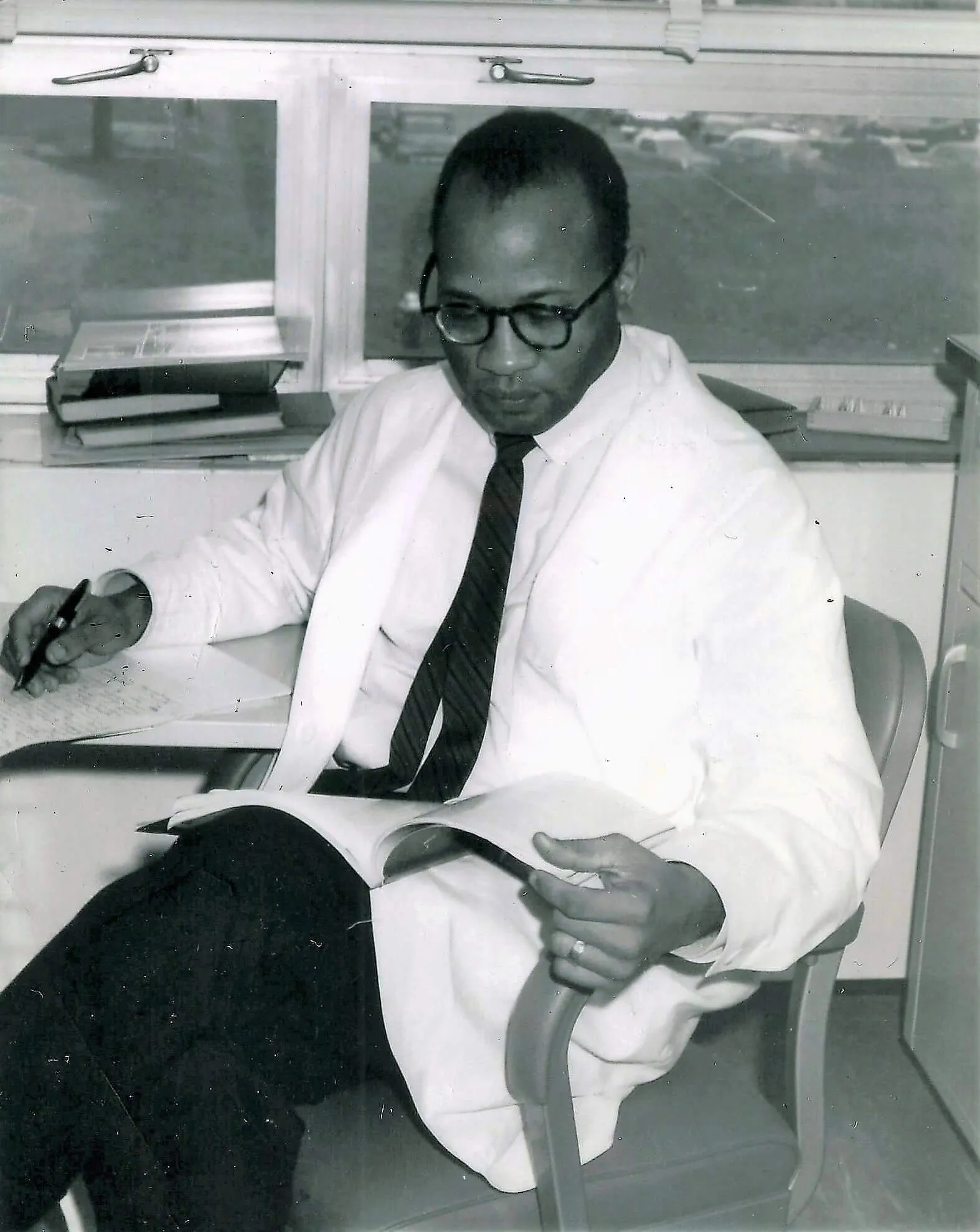 Dr. Jackson Clemmons in his Pathology Lab in a white coat