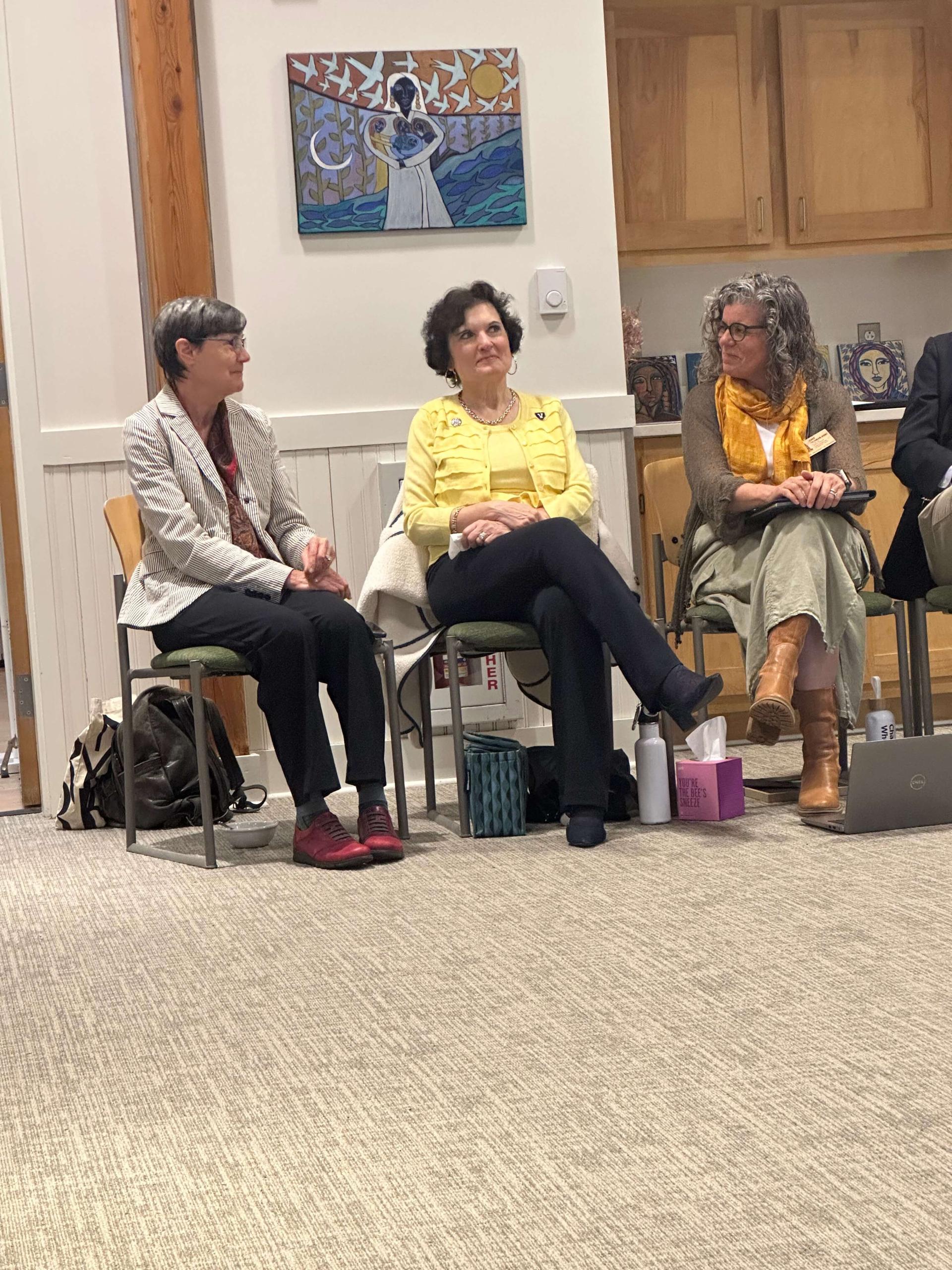 Langevin Prelock Feldman-Hunt sitting together at a meeting