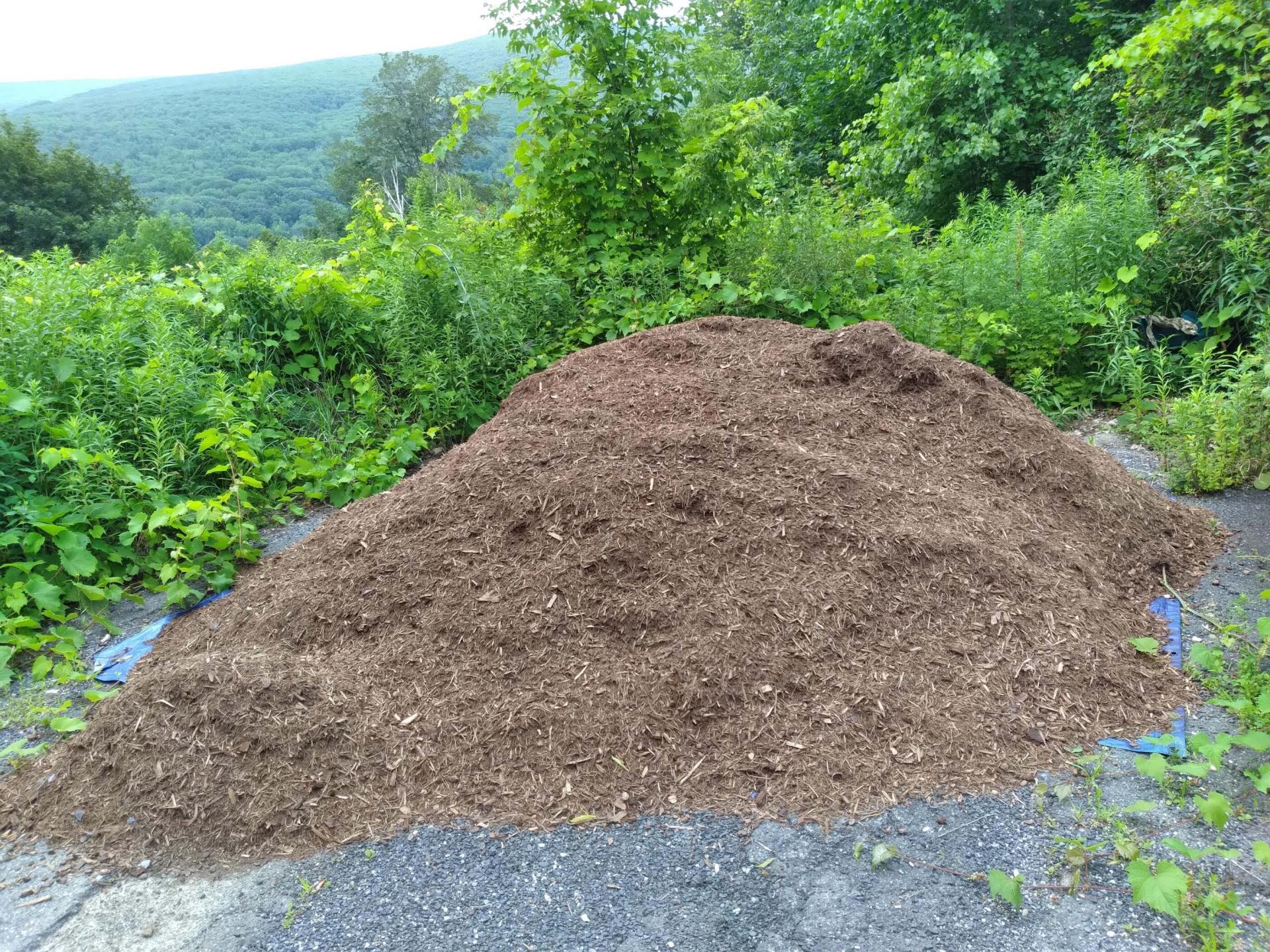 large pile of mulch, outdoors
