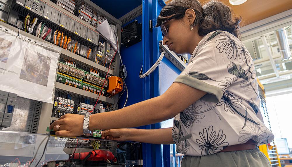 Graduate Research Assistant Madiha Akbar works on the ATL's new electrolyzer