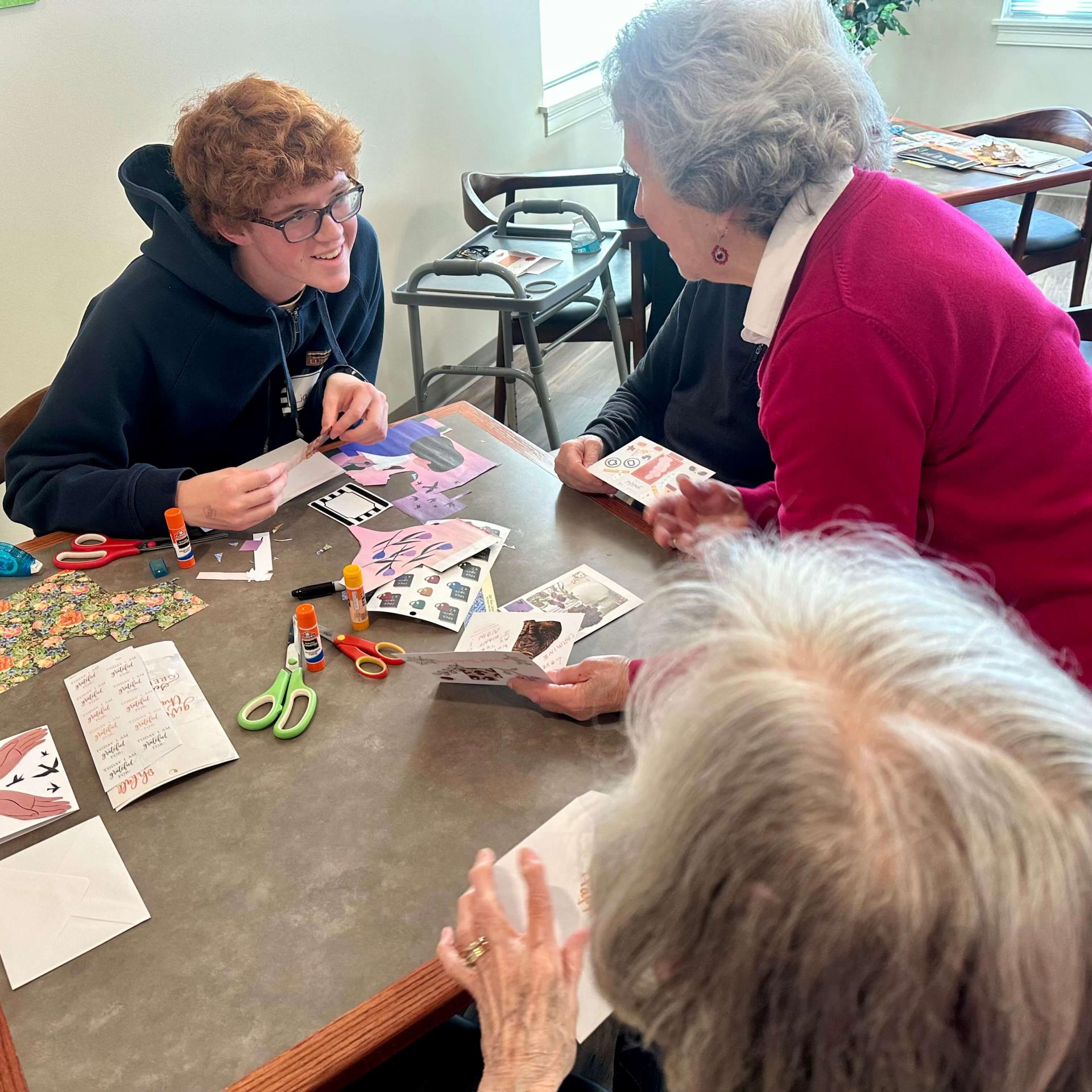 Student speaking with older adult