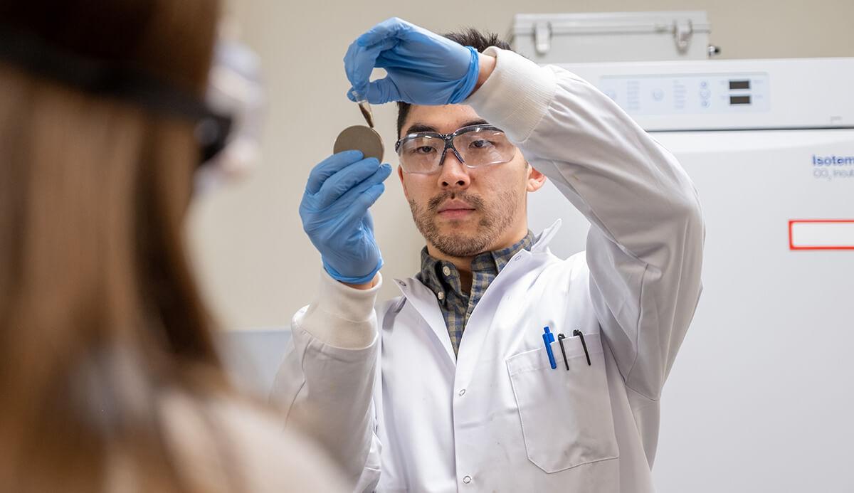 A graduate student provides a demonstration in a BME lab