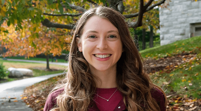 a woman outdoors smiling