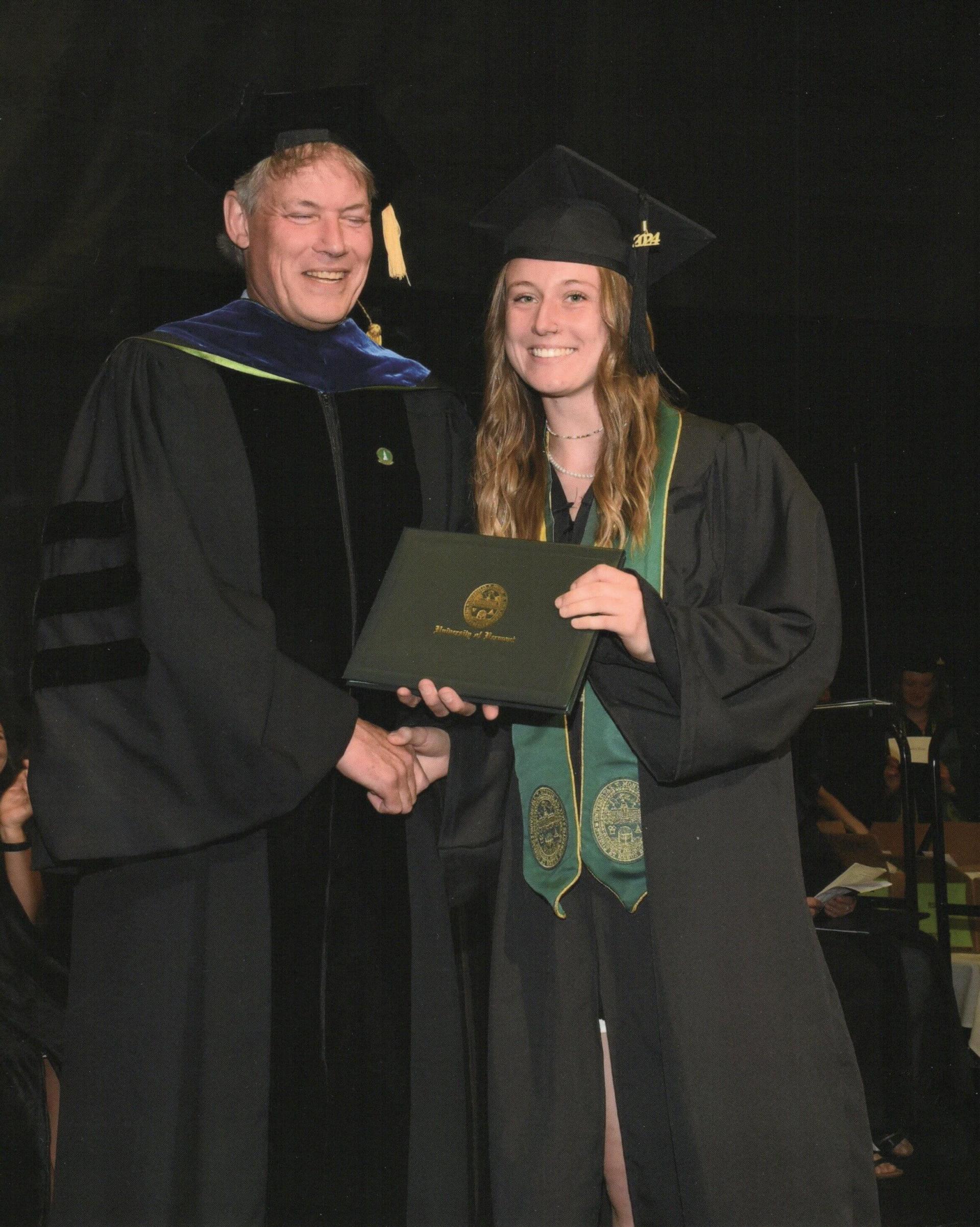 Cat Mawn and Allan Strong shaking hands at Cat's graduation.