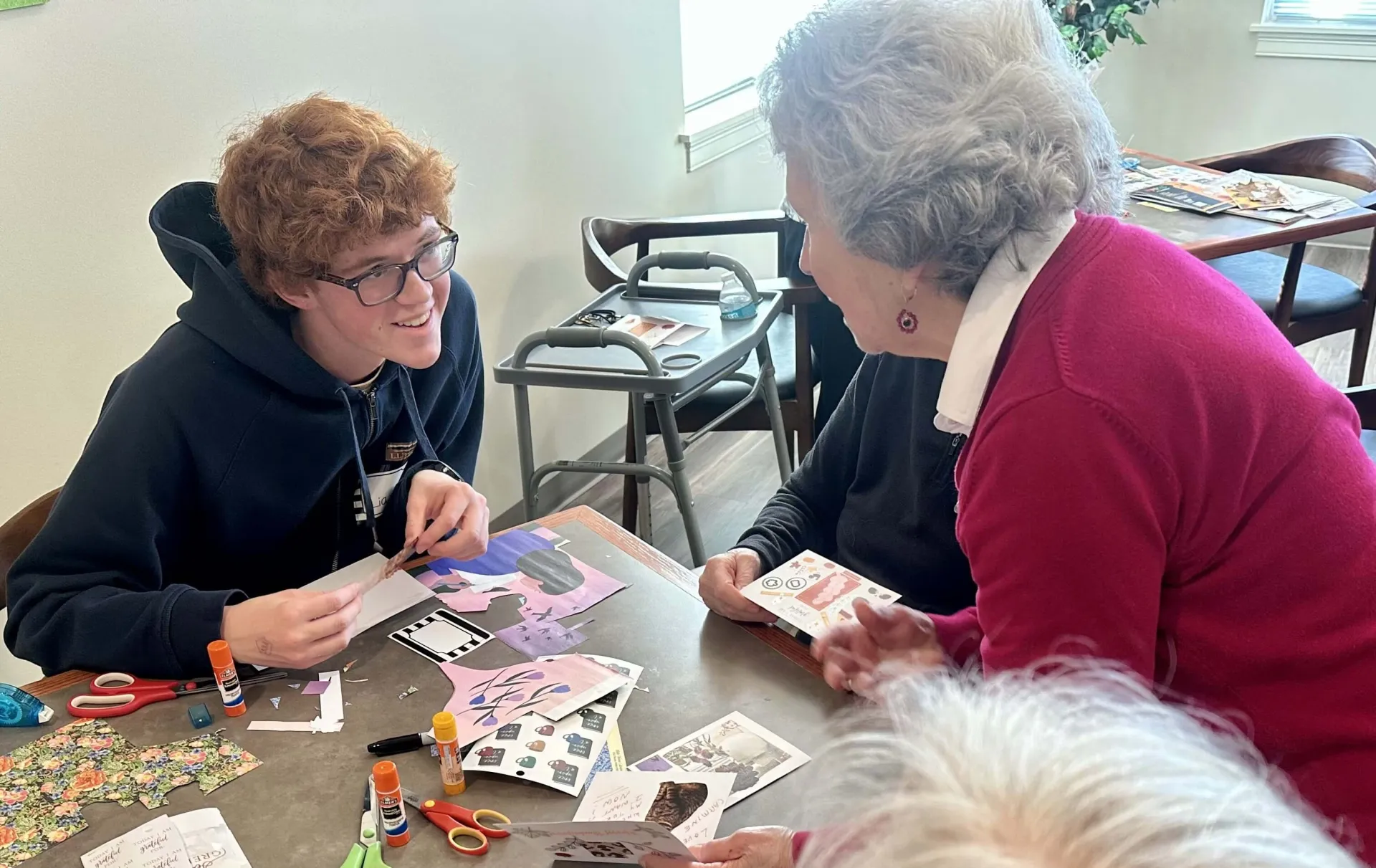 Student speaking with older adult